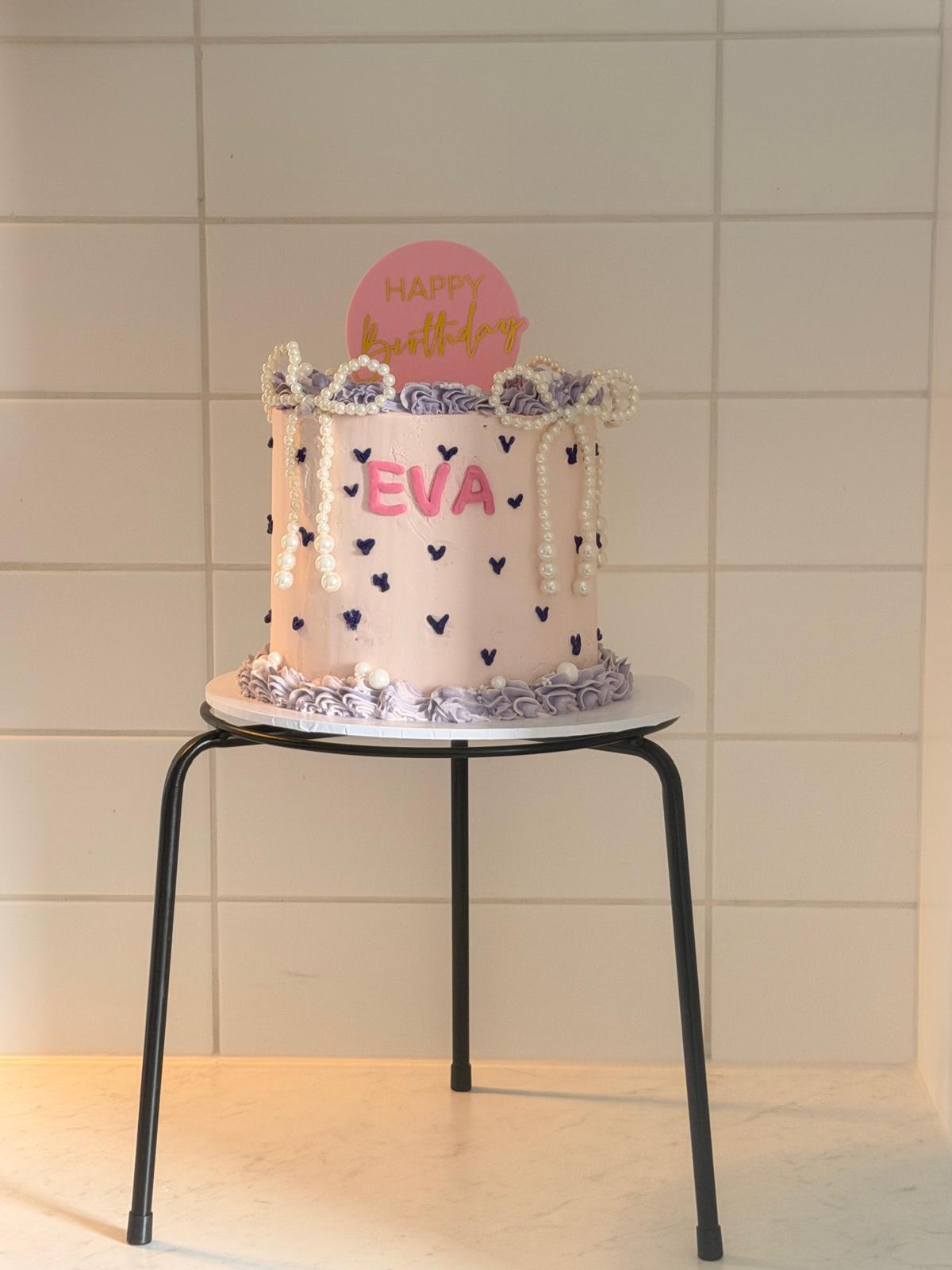 Pastel 'Eva' birthday cake with heart sprinkles