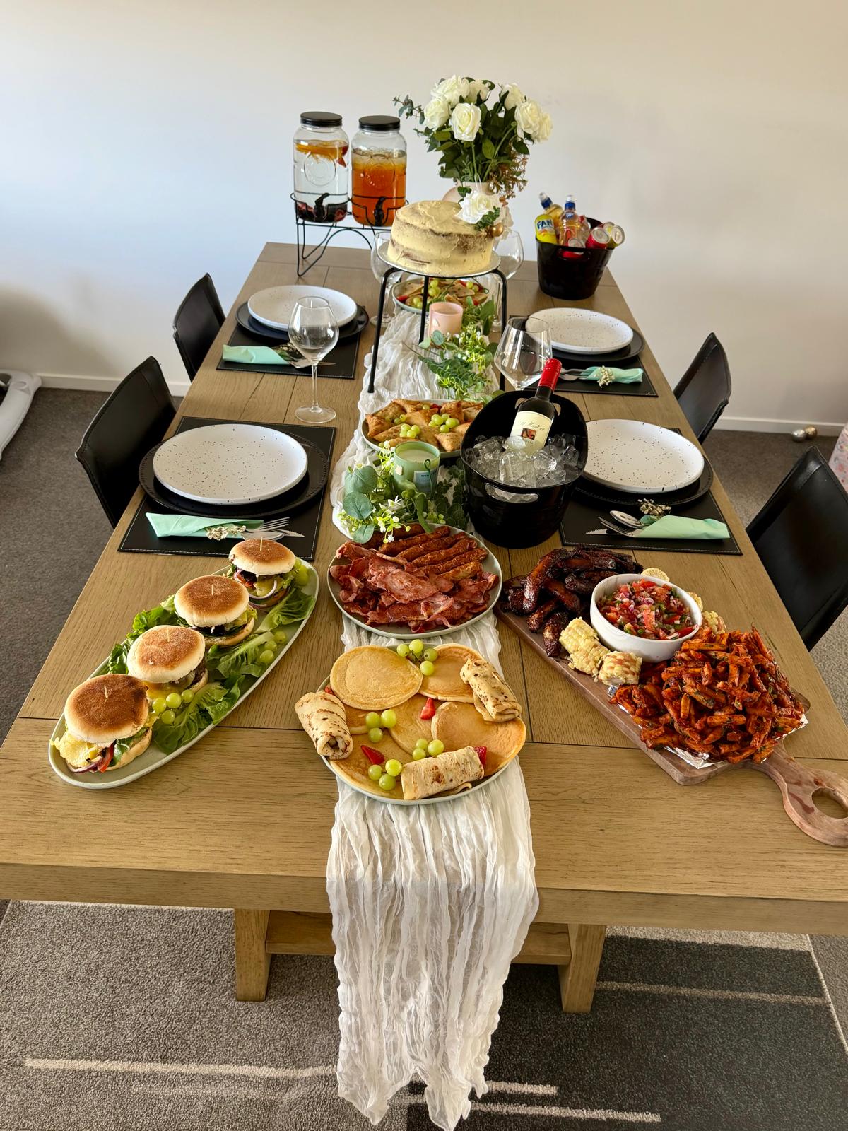 Family dinner table spread with finger foods