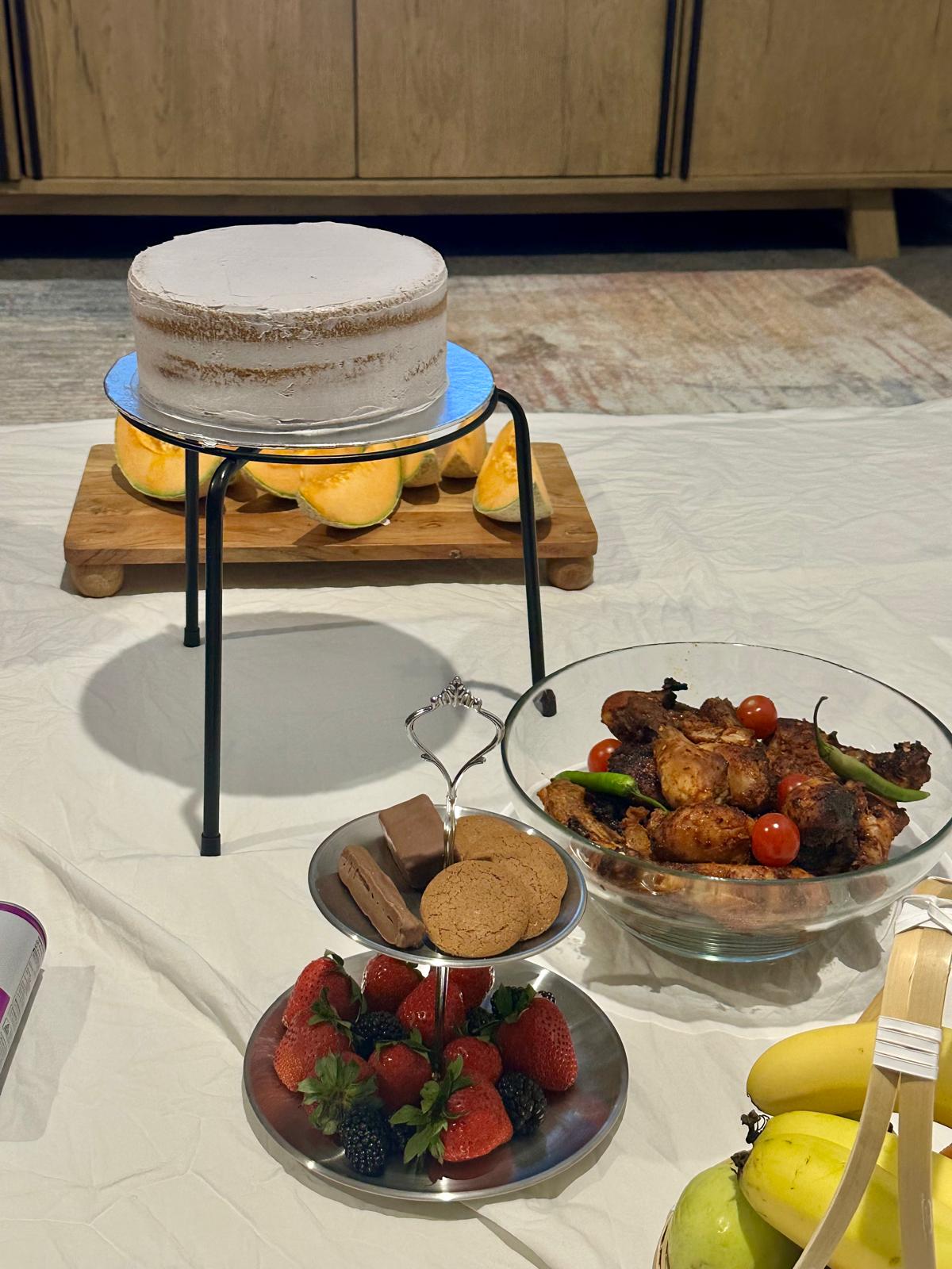 Brunch table with cake, fruit and savouries