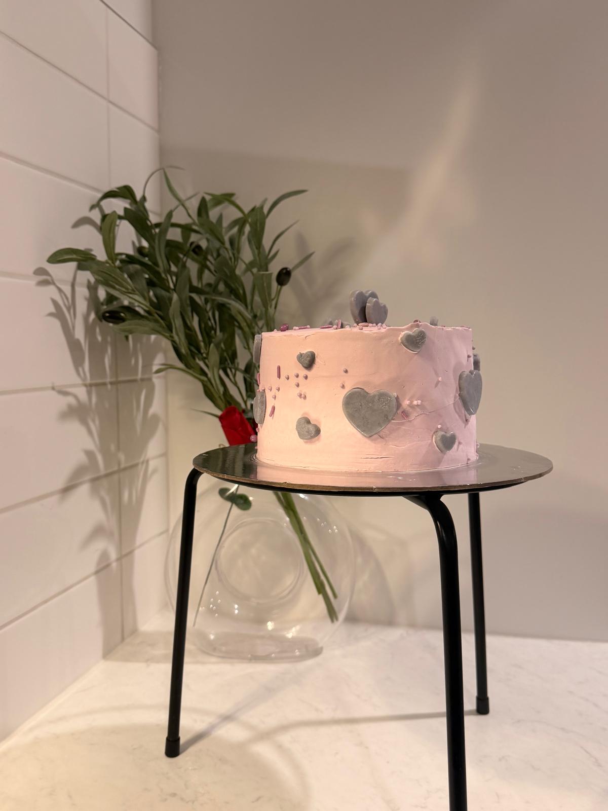 Soft pink heart-detailed cake