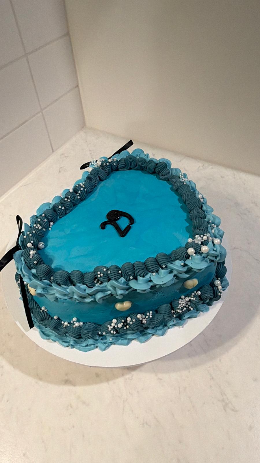 Blue heart-shaped celebration cake