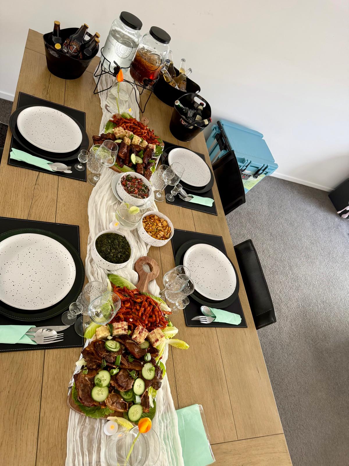 Long dining table set with a family feast