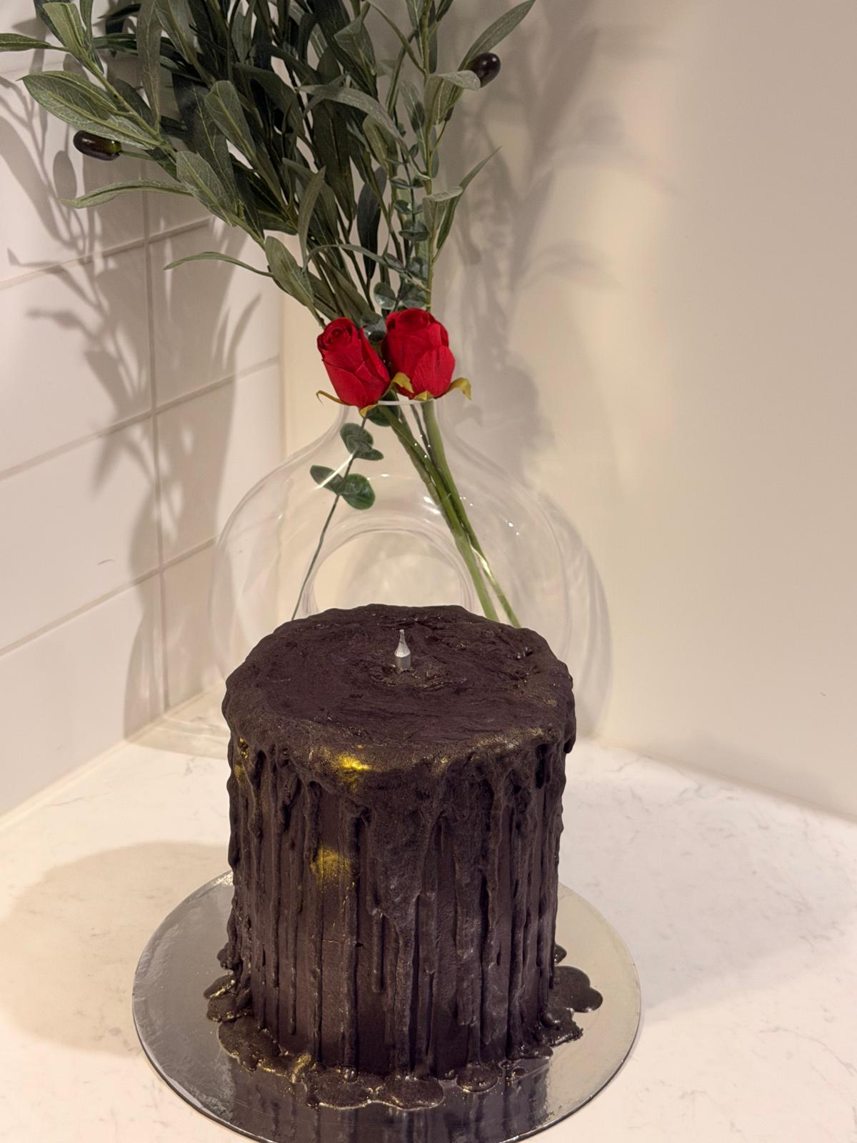 Tall chocolate ganache barrel cake with rose