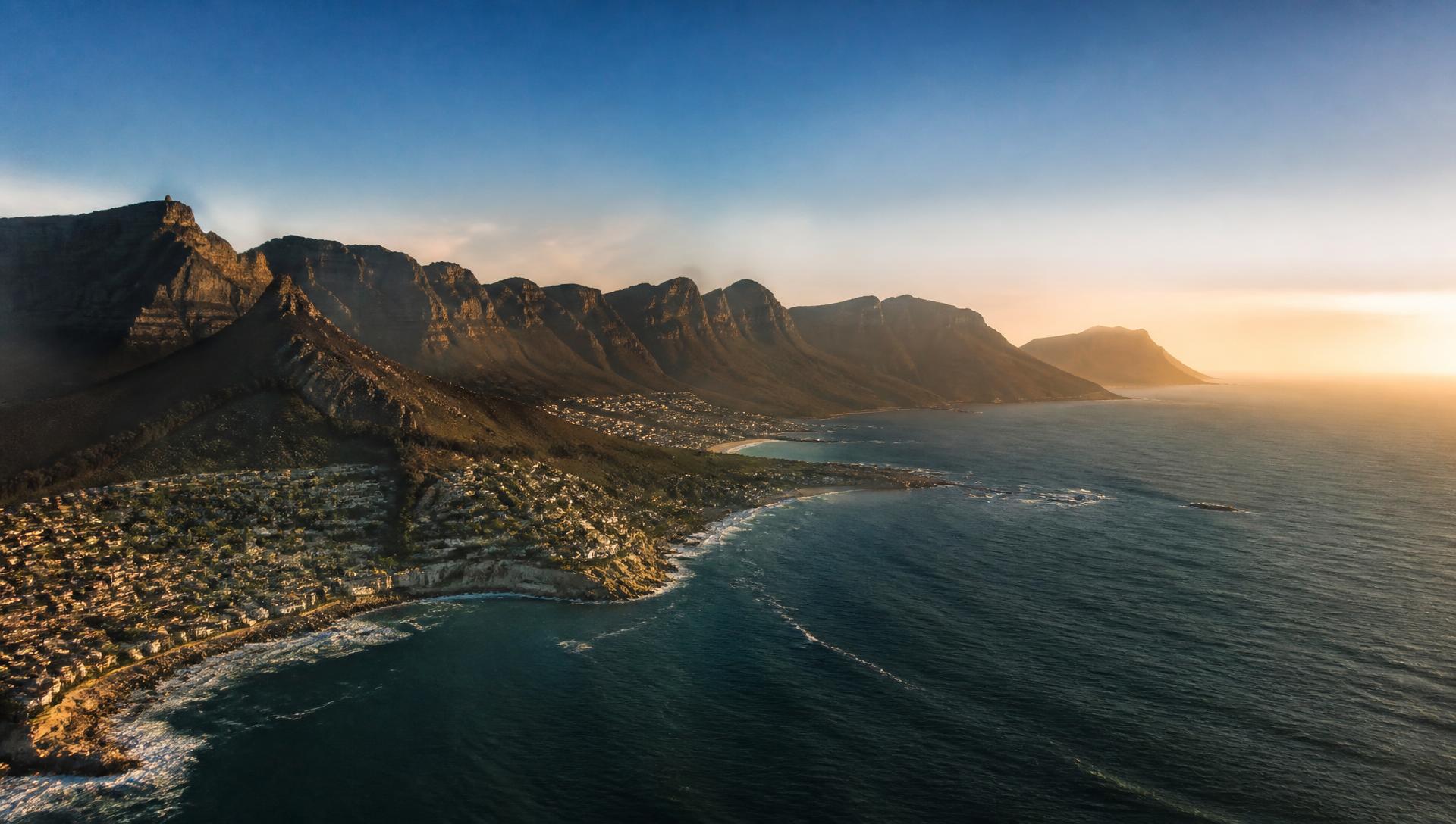 African coastline at sunrise, illustrating climate risk to coastal communities